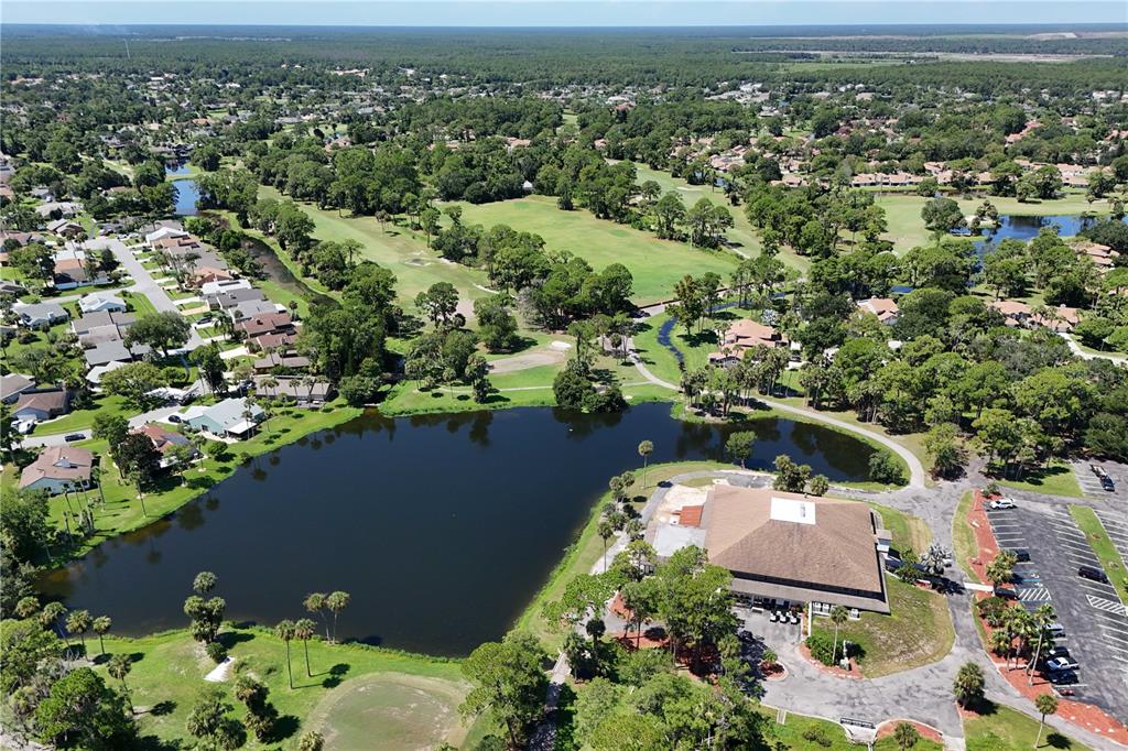 100 Bittern Court Daytona Beach, FL 32119 - Photo 52 of 52 an aerial view of a house with a lake view
