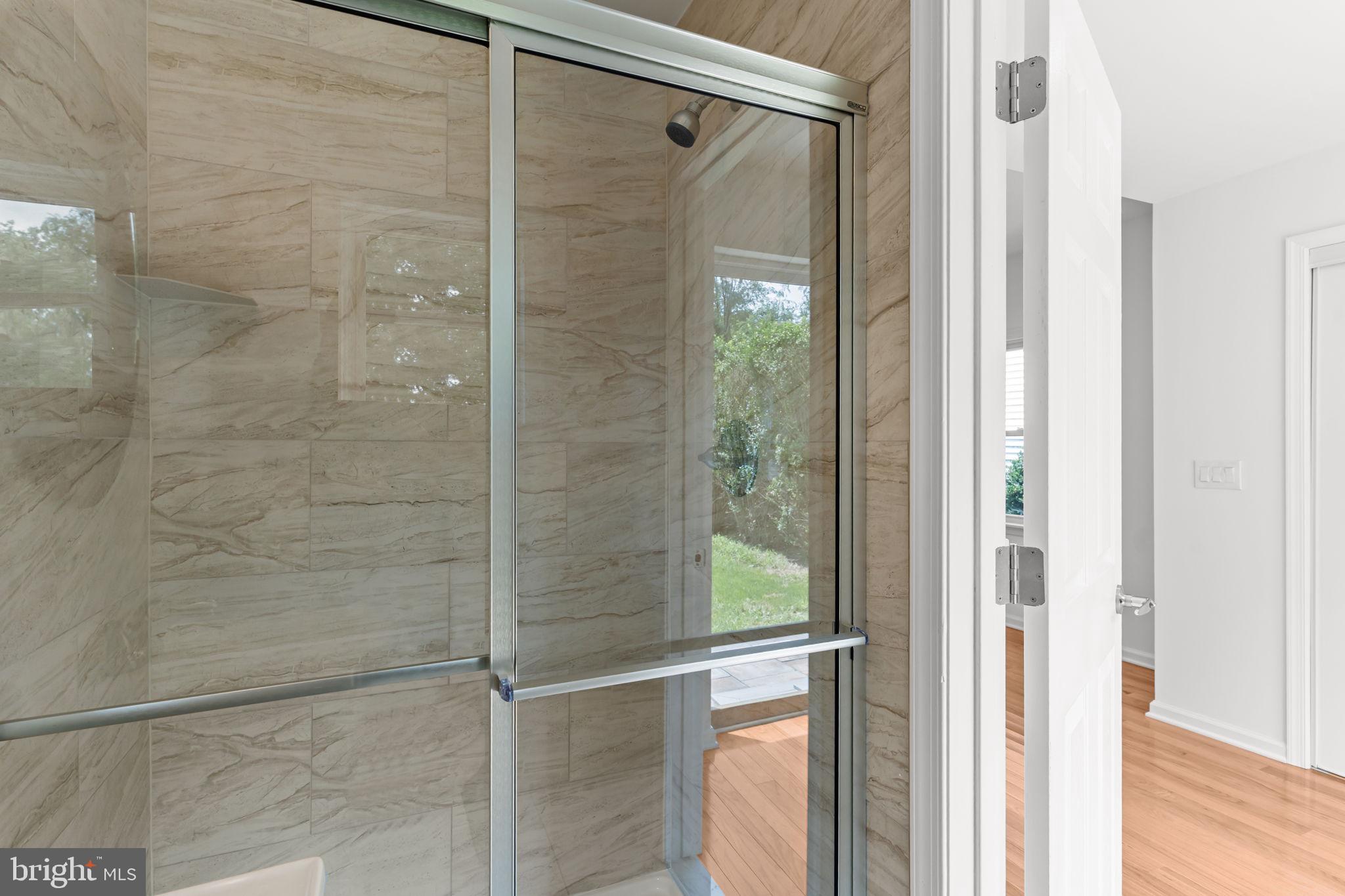 446 Pond Street Bristol, PA 19007 - Photo 19 of 35 a bathroom with a glass shower door