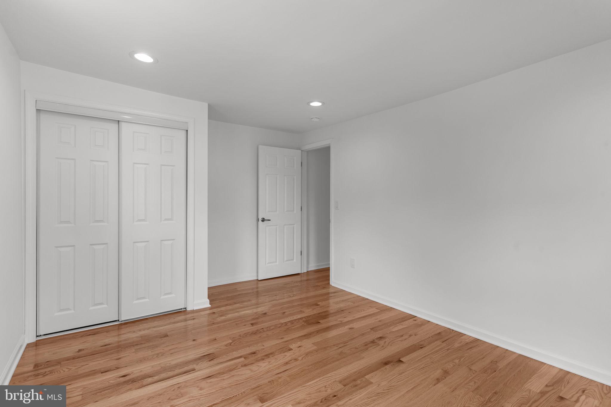 446 Pond Street Bristol, PA 19007 - Photo 20 of 35 a view of an empty room with wooden floor