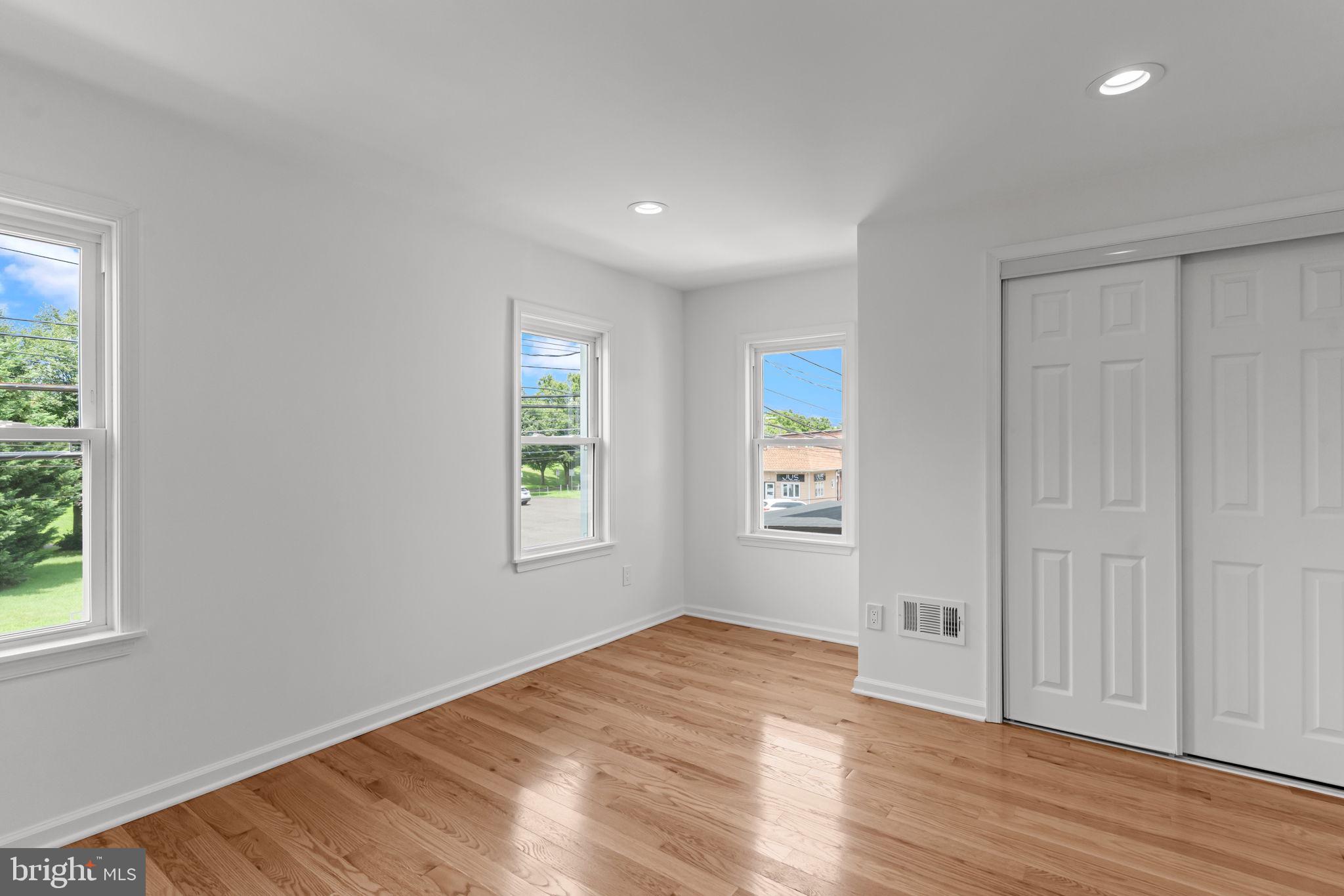 446 Pond Street Bristol, PA 19007 - Photo 21 of 35 a view of empty room with wooden floor and fan
