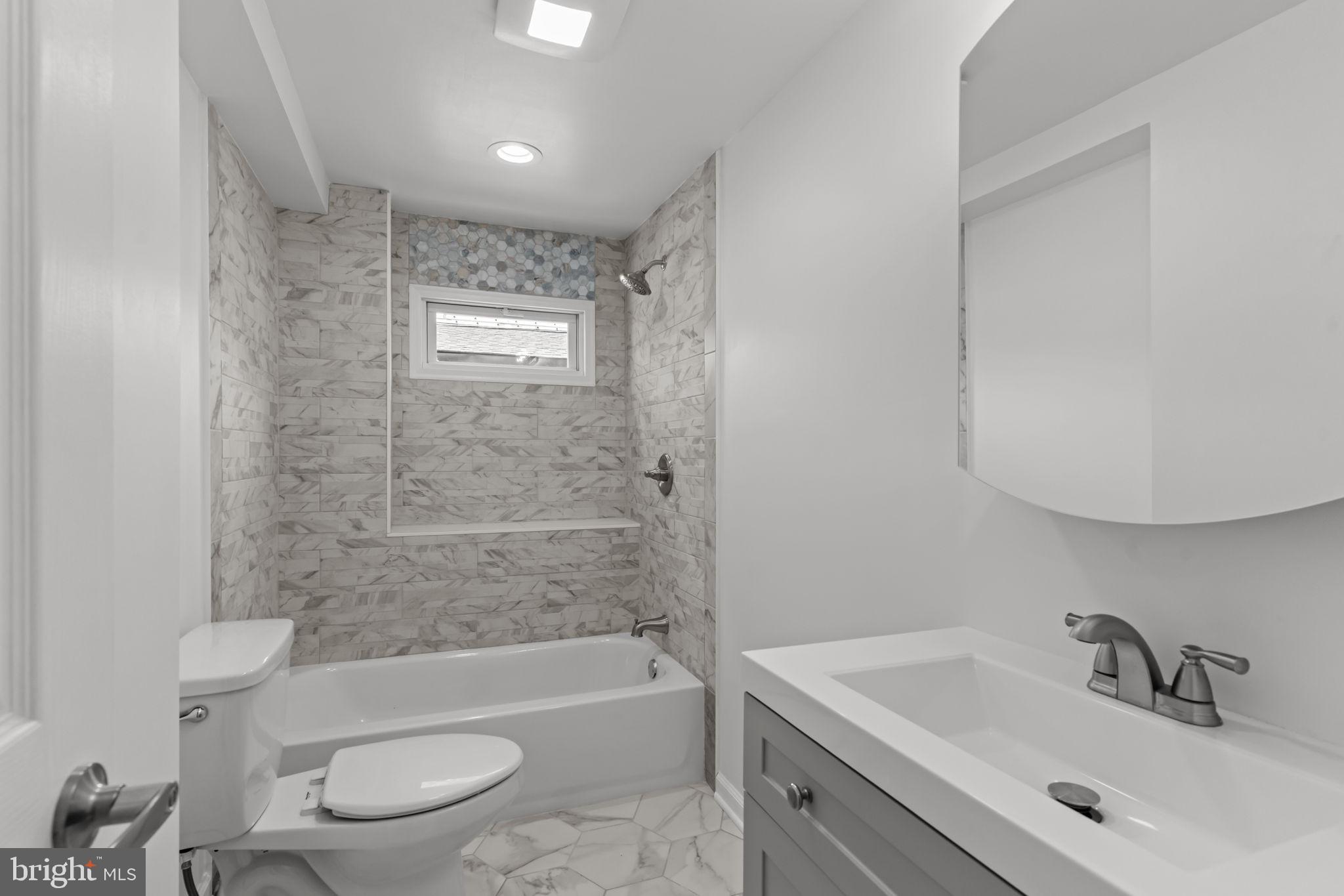 446 Pond Street Bristol, PA 19007 - Photo 23 of 35 a bathroom with a sink toilet and bathtub