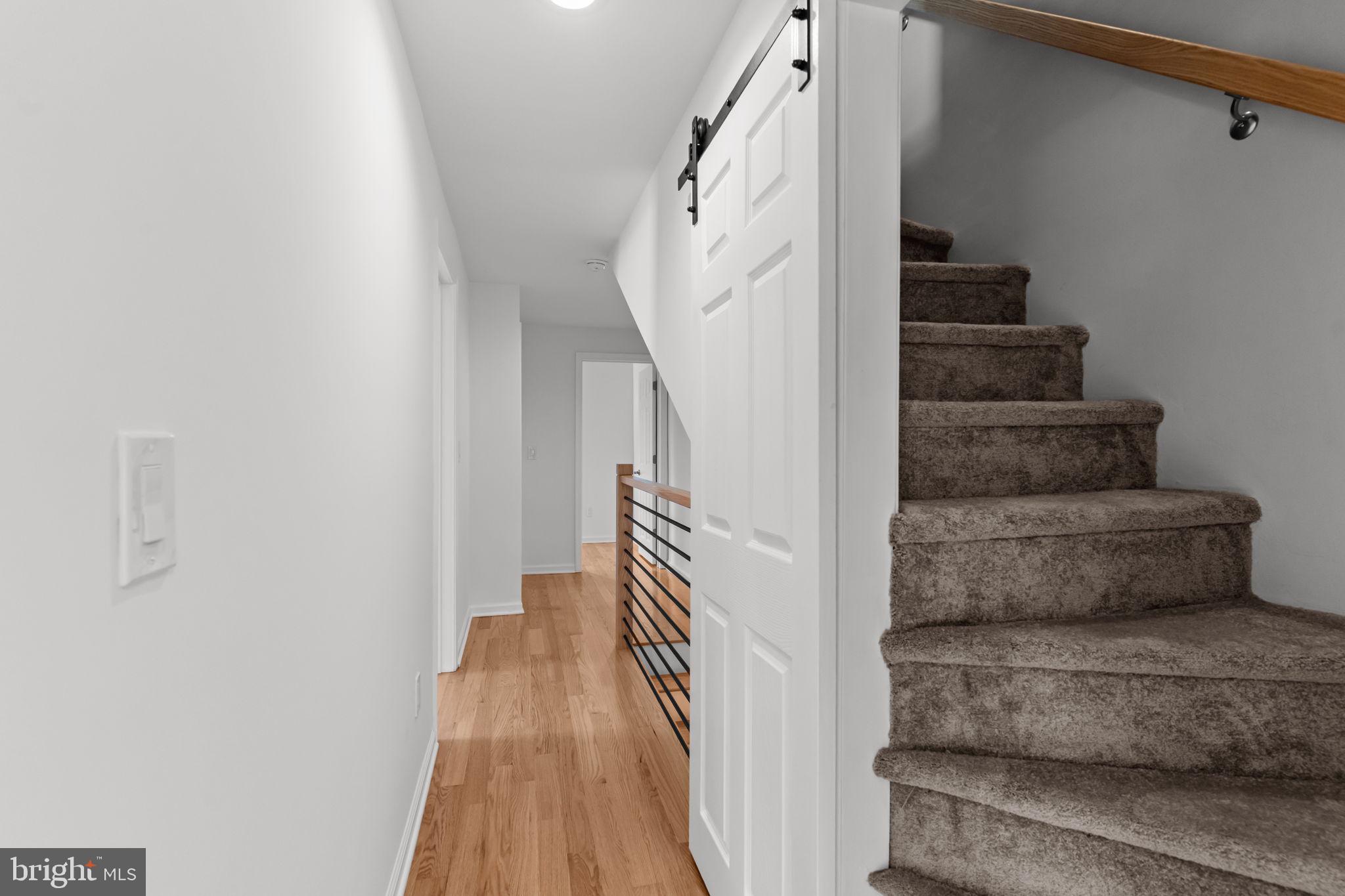 446 Pond Street Bristol, PA 19007 - Photo 26 of 35 a view of entryway and hall with wooden floor