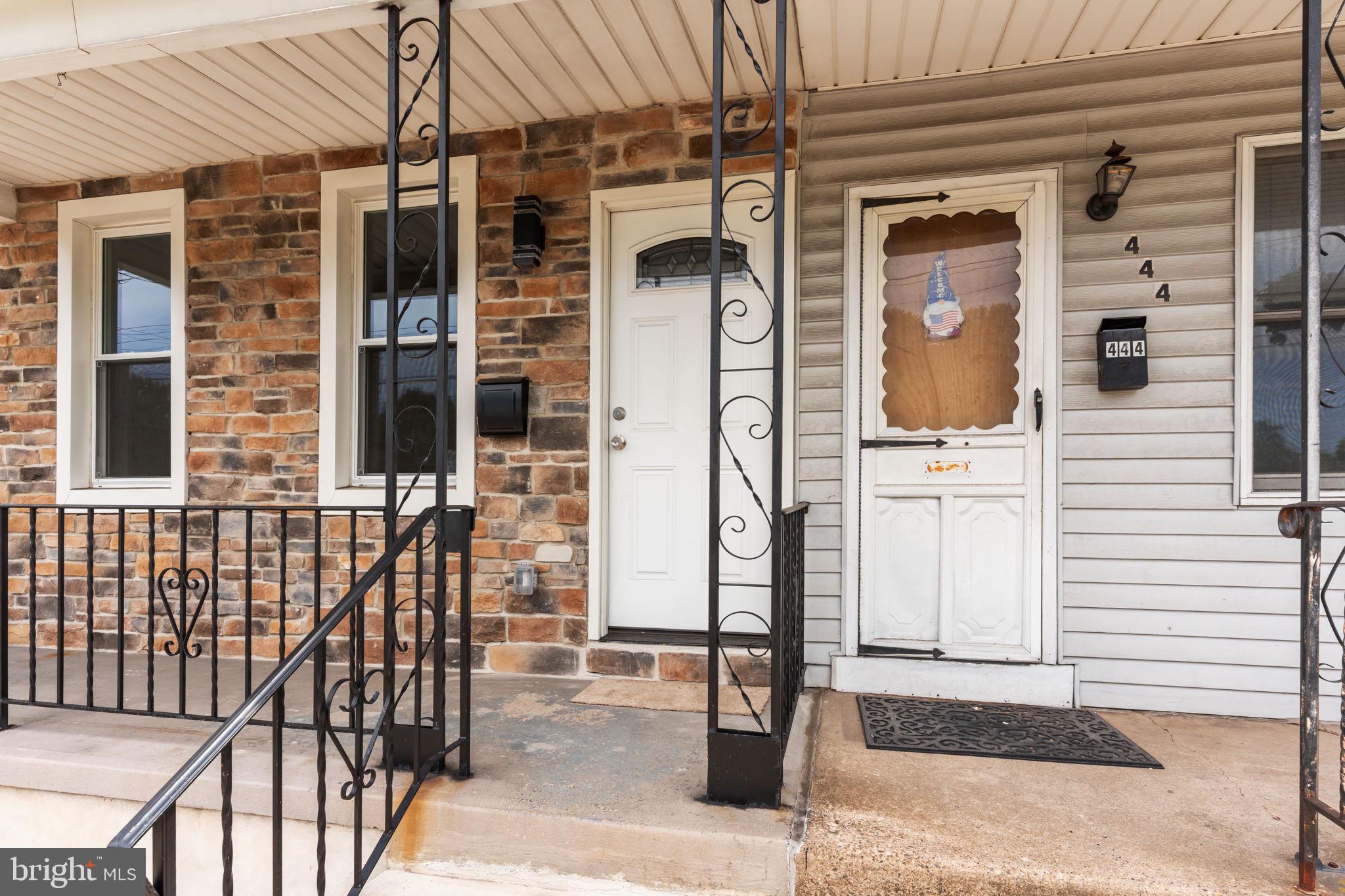 446 Pond Street Bristol, PA 19007 - Photo 5 of 35 a front view of a house with a glass door