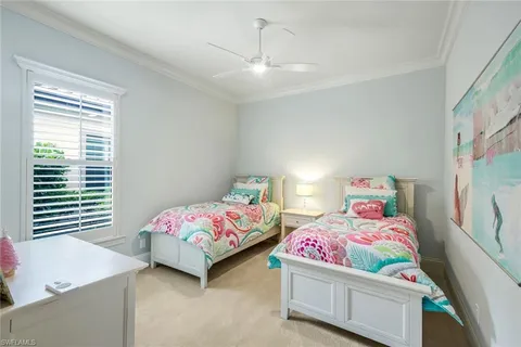 a bedroom with bed and a window