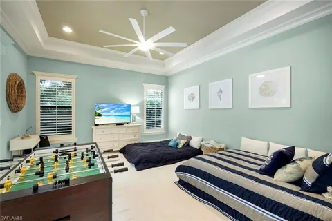 a bedroom with furniture and a window