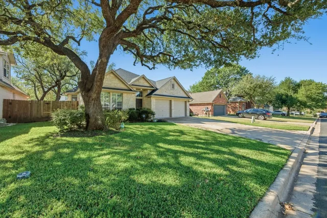 a house with huge green field in front of it