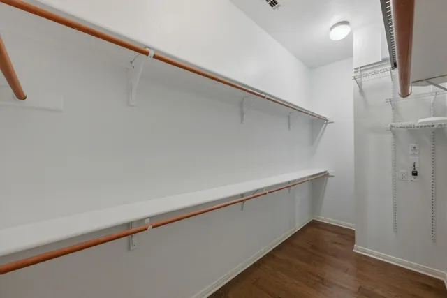 a view of an empty walk in closet