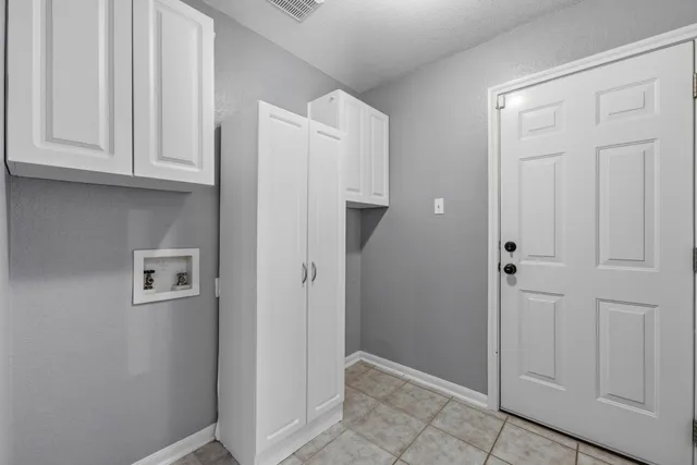 a view of a house with a tree