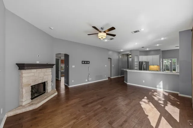 a view of livingroom and a fireplace with wooden floor