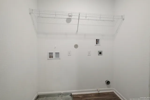 a view of small space with empty racks on the wall