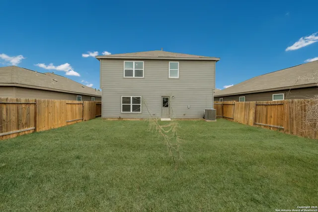 a view of a backyard with a garden and plants