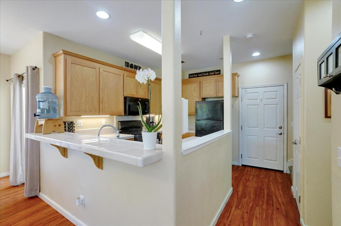 15525 Watsonville Road Morgan Hill, CA 95037 - Photo 11 of 36 a view of a hallway with wooden floor and living room