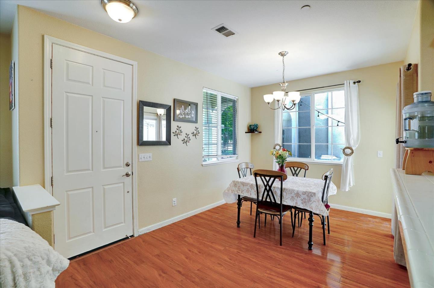 15525 Watsonville Road Morgan Hill, CA 95037 - Photo 16 of 36 a view of a dining room with furniture window and wooden floor