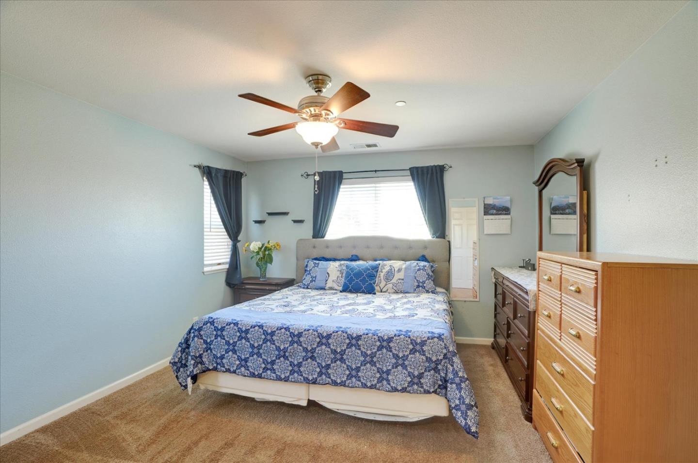 15525 Watsonville Road Morgan Hill, CA 95037 - Photo 25 of 36 a bedroom with a bed dresser and a window