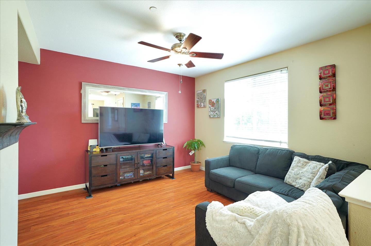 15525 Watsonville Road Morgan Hill, CA 95037 - Photo 10 of 36 a living room with furniture and a flat screen tv