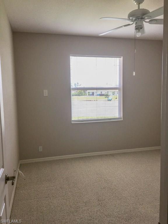 2161 Rusty Fig Court Naples, FL 34120 - Photo 15 of 17 an empty room with a window