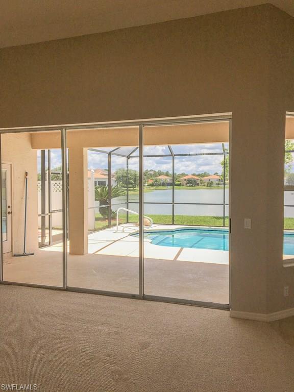 2161 Rusty Fig Court Naples, FL 34120 - Photo 6 of 17 a view of an empty room and window