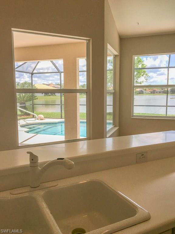 2161 Rusty Fig Court Naples, FL 34120 - Photo 7 of 17 a view of an empty room with a window