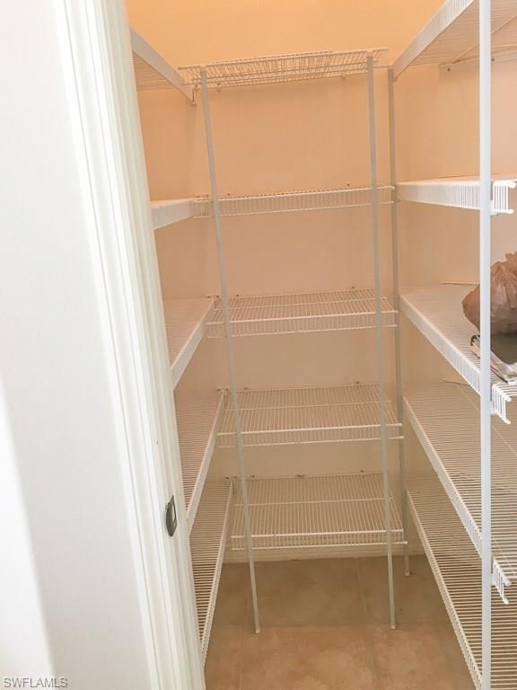2161 Rusty Fig Court Naples, FL 34120 - Photo 9 of 17 a view of walk in closet