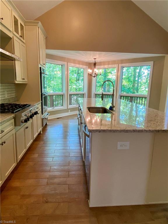 800 Scott Road Lewisville, NC 27023 - Photo 11 of 30 Chef's kitchen with double ovens, microwave, and warming drawer.