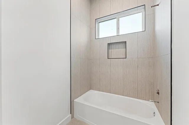 a bathroom with a toilet a sink and a mirror