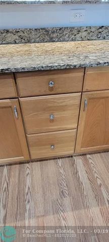 a living room with furniture and a lamp