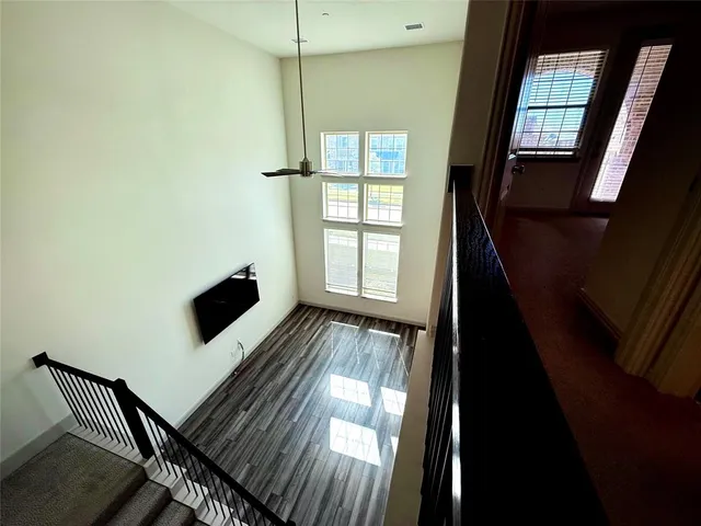 a view of a livingroom with furniture and staircase