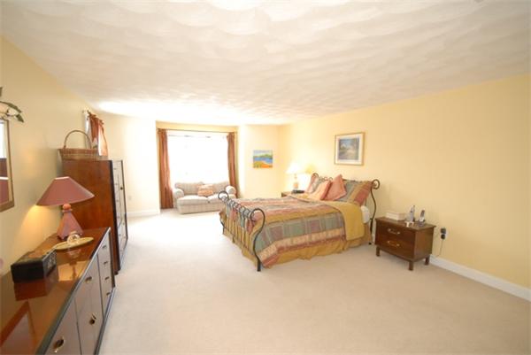 55 Ballardvale Road Andover, MA 01810 - Photo 17 of 26 a spacious bedroom with a bed and window
