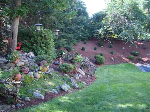 55 Ballardvale Road Andover, MA 01810 - Photo 6 of 26 a view of a garden with flowers