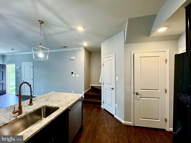 a view of hallway with wooden floor