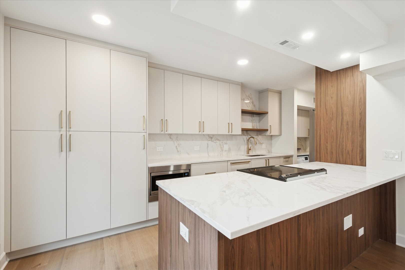 1420 Sheridan Road, Unit 3I Wilmette, IL 60091 - Photo 3 of 16 a kitchen with a sink a stove a refrigerator and white cabinets