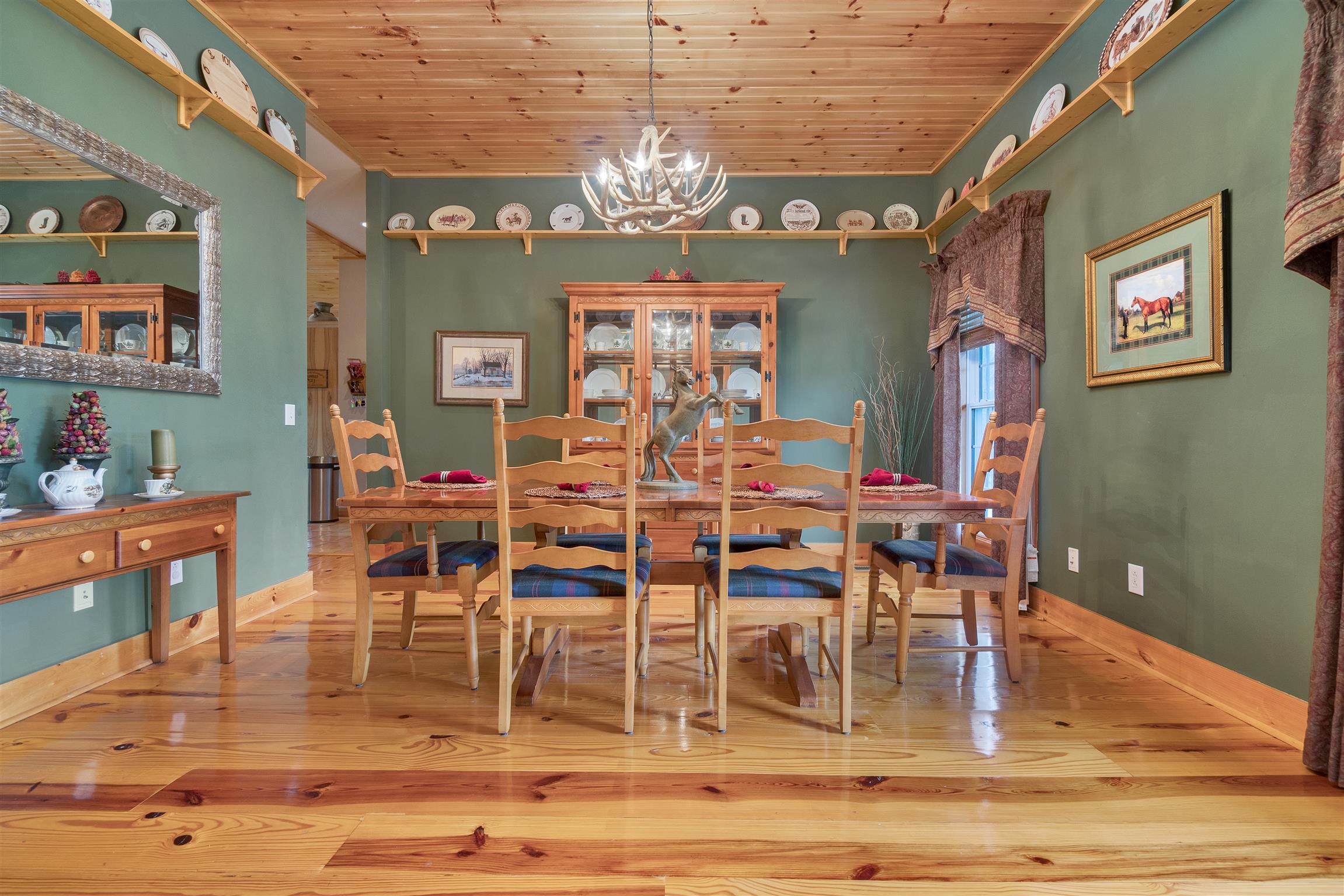 2339 Lawrence Lane Springfield, TN 37172 - Photo 8 of 30 a dining room with wooden floor a chandelier a glass table and chairs