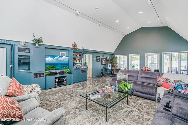 a view of a house with a yard and sitting area