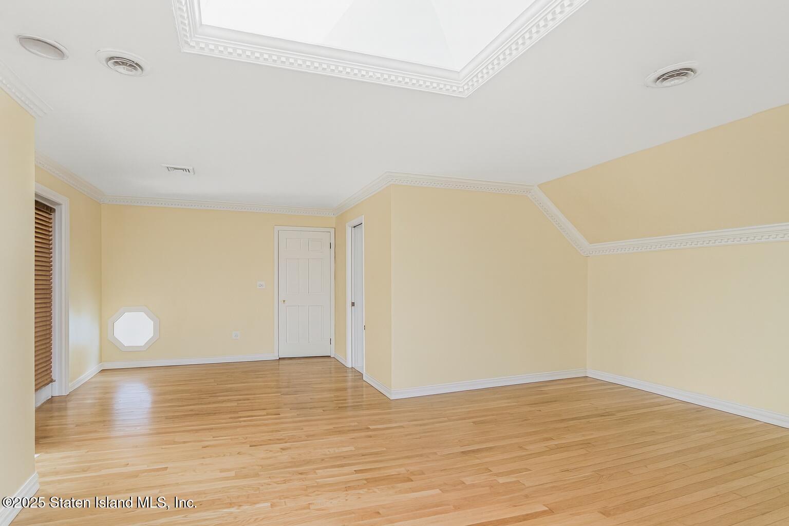 26 Highpoint Road Staten Island, NY 10304 - Photo 19 of 36 a view of a room with wooden floor