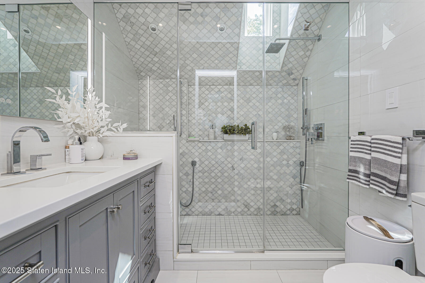 26 Highpoint Road Staten Island, NY 10304 - Photo 21 of 36 a bathroom with a granite countertop sink toilet and shower