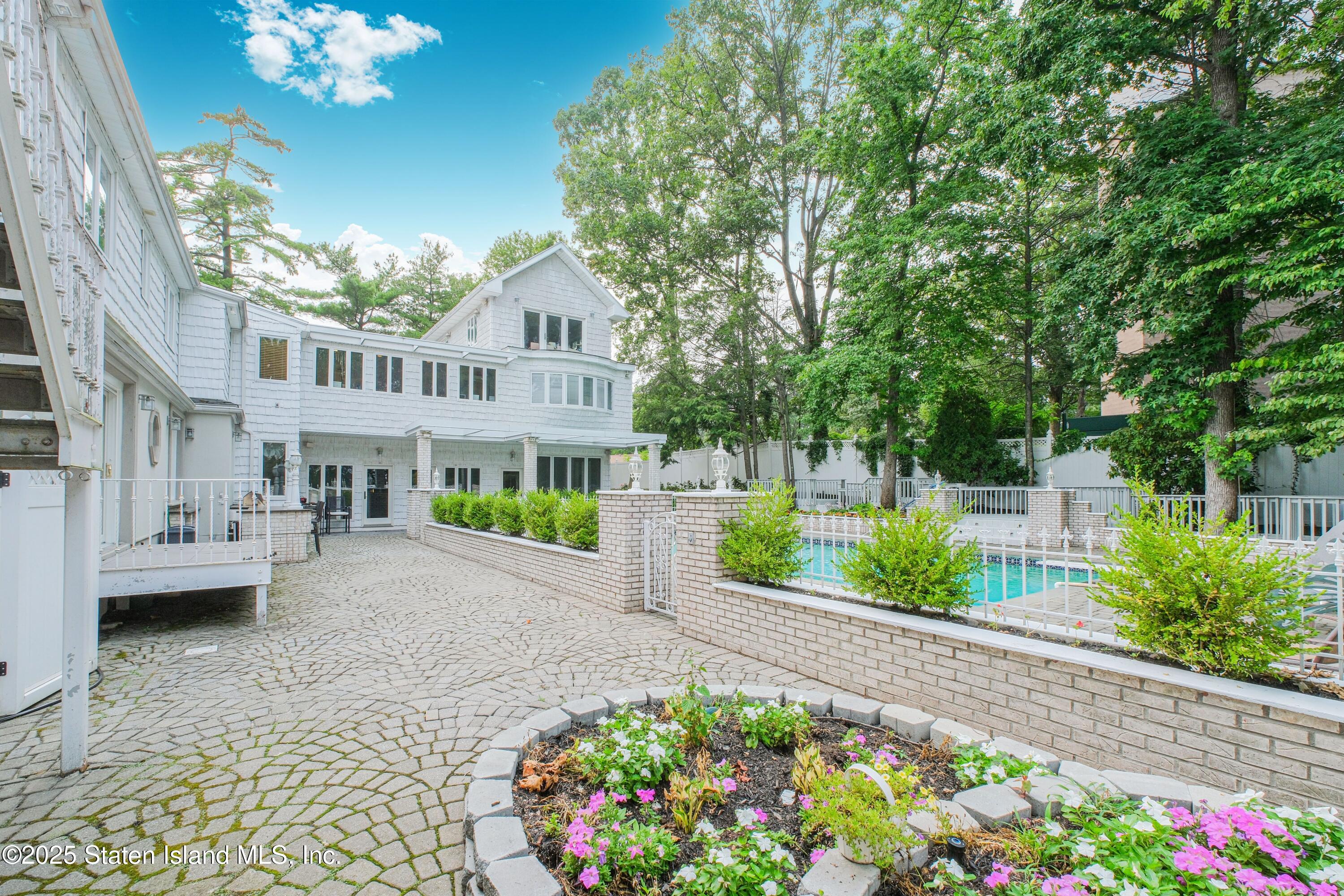 26 Highpoint Road Staten Island, NY 10304 - Photo 29 of 36 a front view of a house with a yard