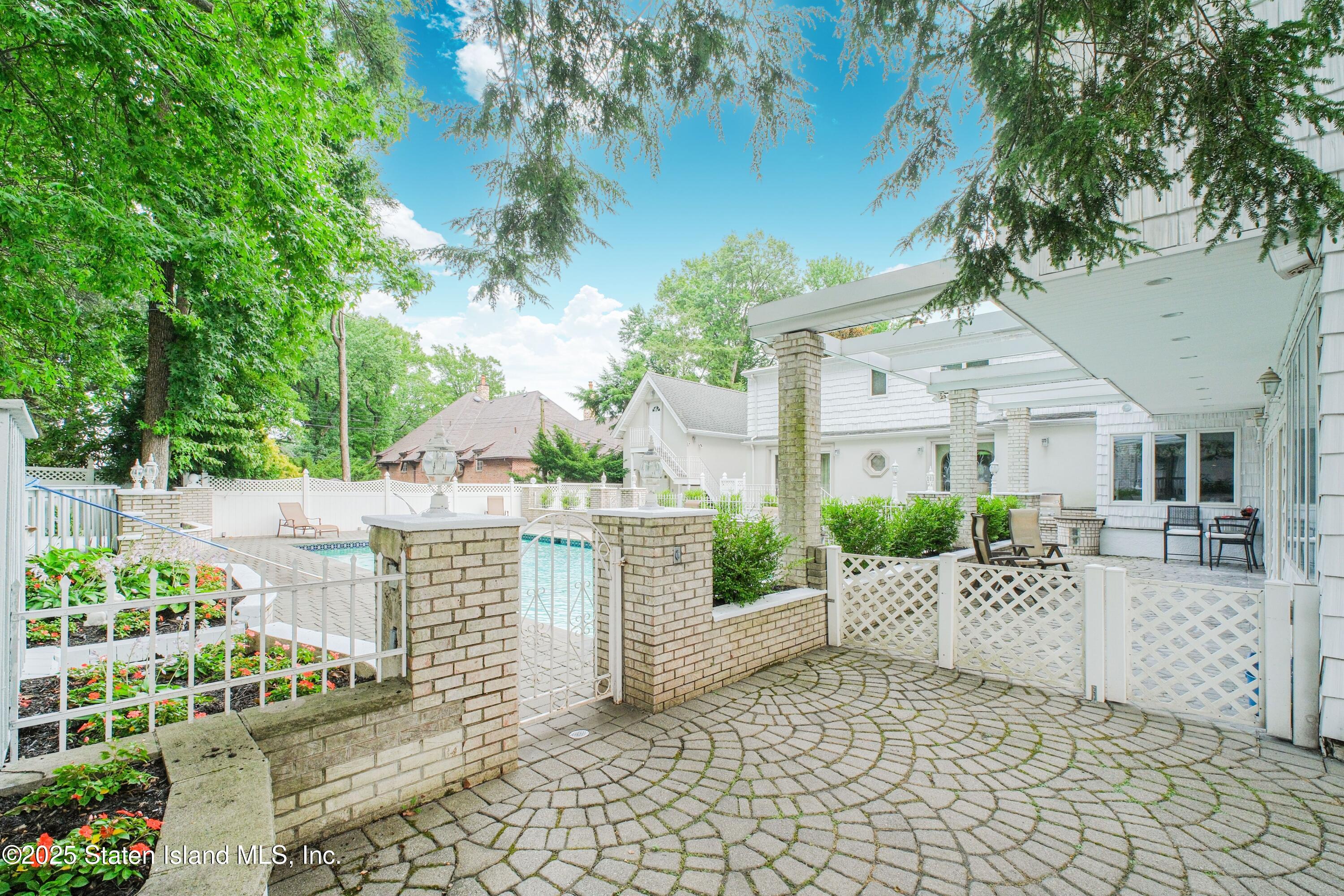 26 Highpoint Road Staten Island, NY 10304 - Photo 31 of 36 a view of a house with a yard and sitting area