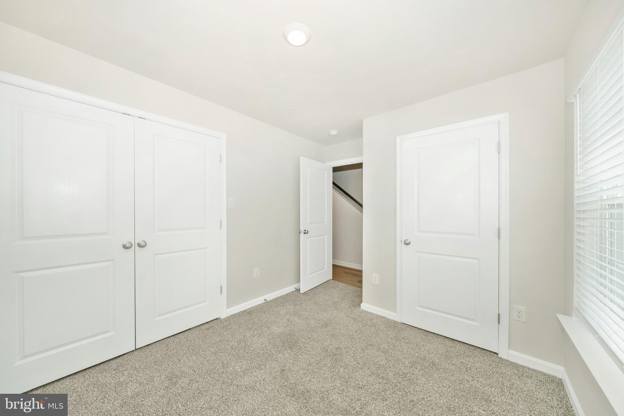 8634 Walter Martz Road Frederick, MD 21702 - Photo 16 of 52 an empty room with a natural light