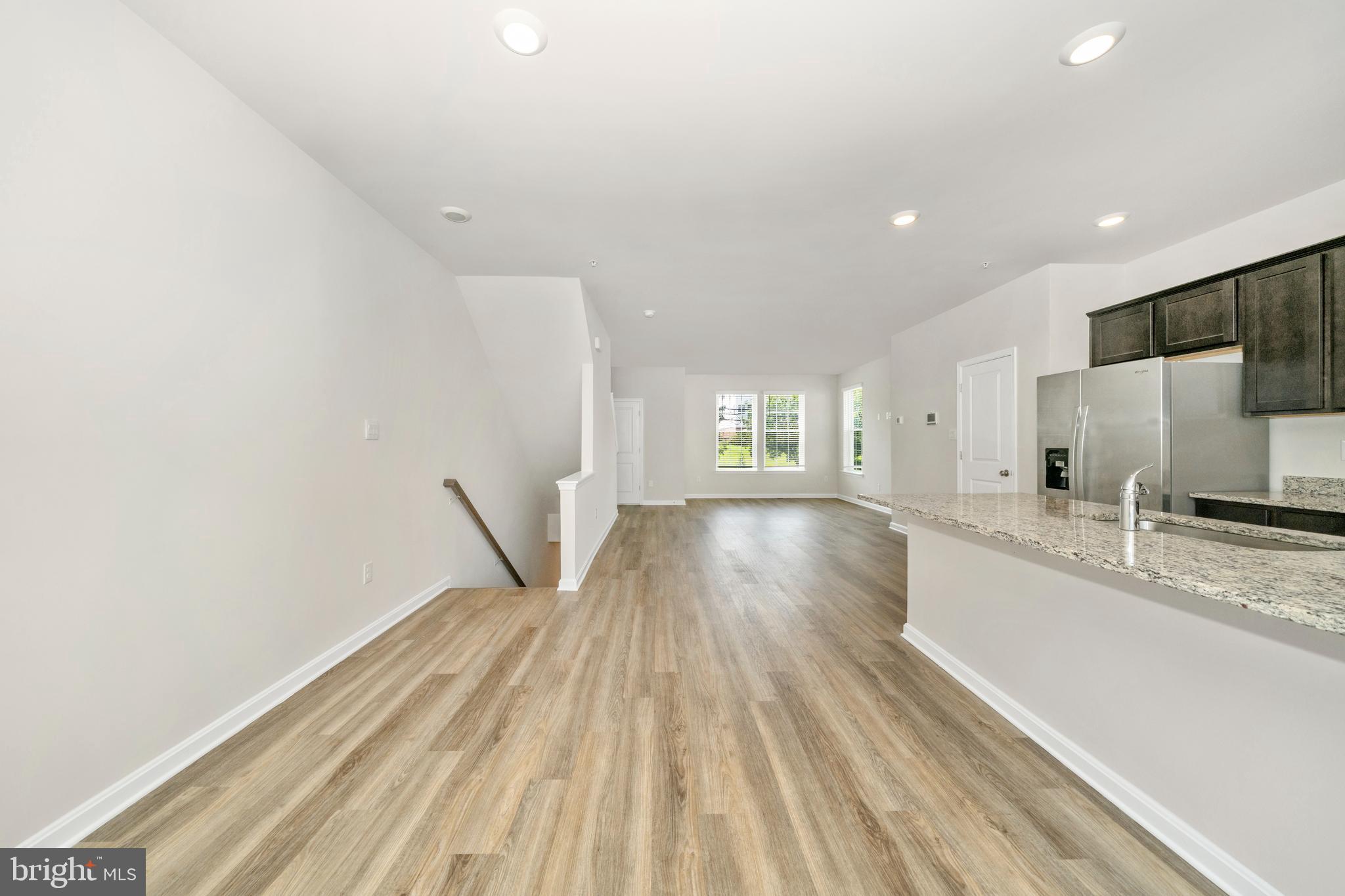 8634 Walter Martz Road Frederick, MD 21702 - Photo 22 of 52 a view of a kitchen with wooden floor and a window