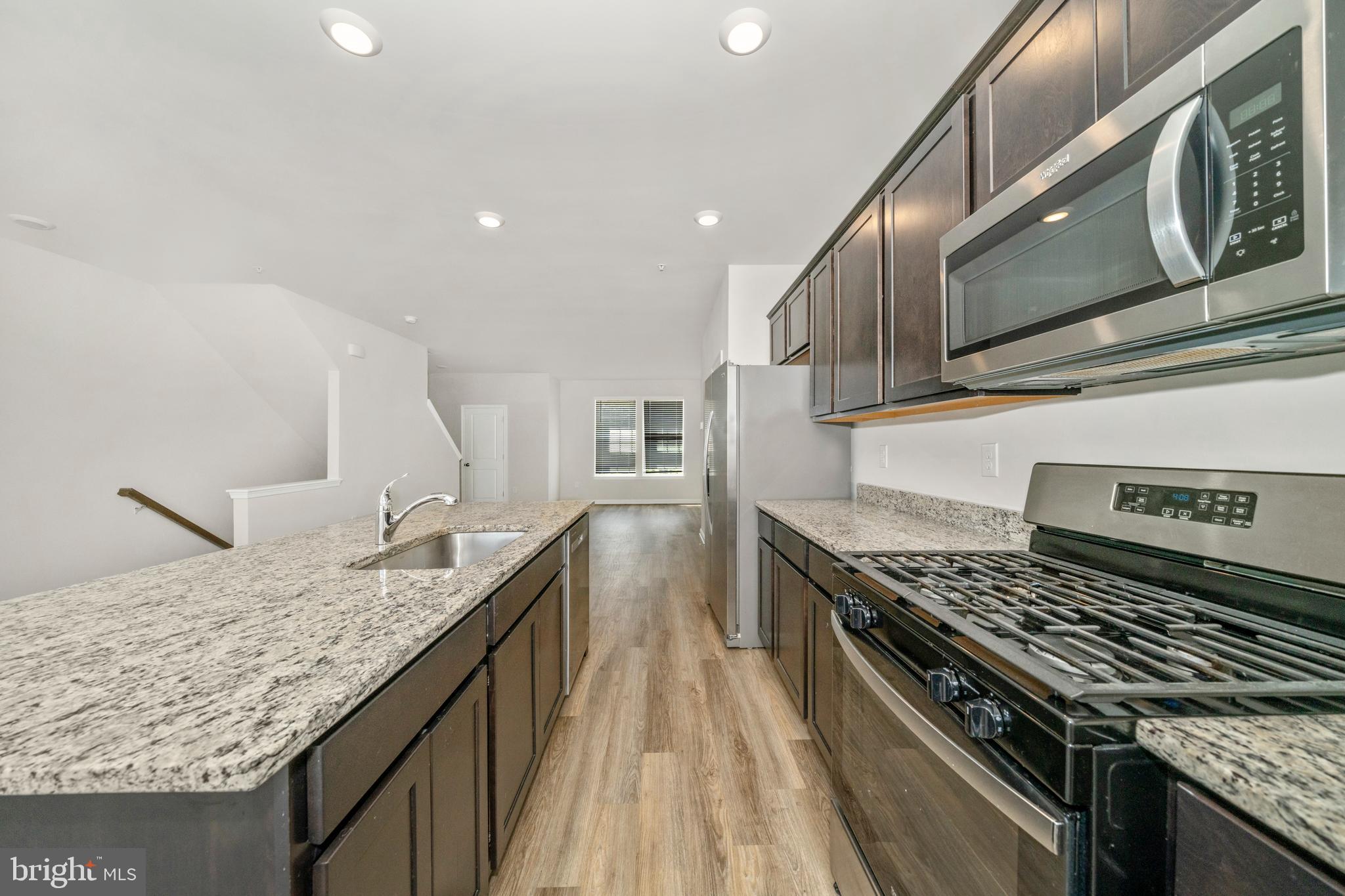 8634 Walter Martz Road Frederick, MD 21702 - Photo 4 of 52 a kitchen with granite countertop stainless steel appliances window and stove