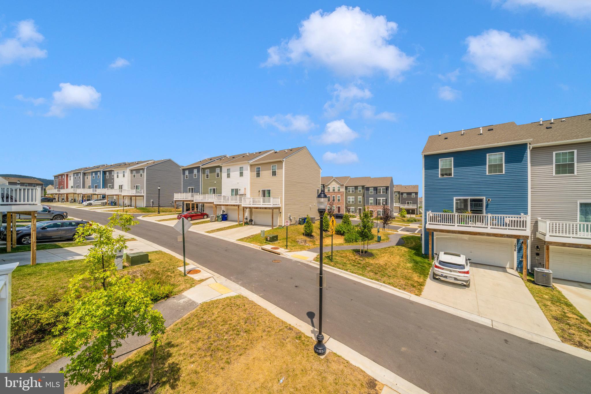 8634 Walter Martz Road Frederick, MD 21702 - Photo 46 of 52 a view of a swimming pool with a lawn chairs under an umbrella