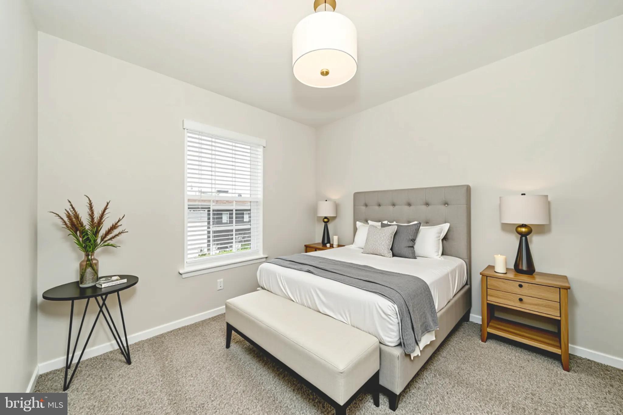 8634 Walter Martz Road Frederick, MD 21702 - Photo 9 of 52 a bedroom with a bed and a chandelier