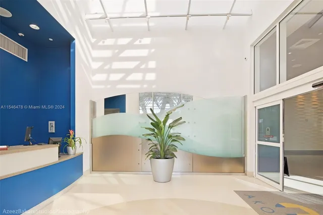 a potted plant sitting in front of a bathroom