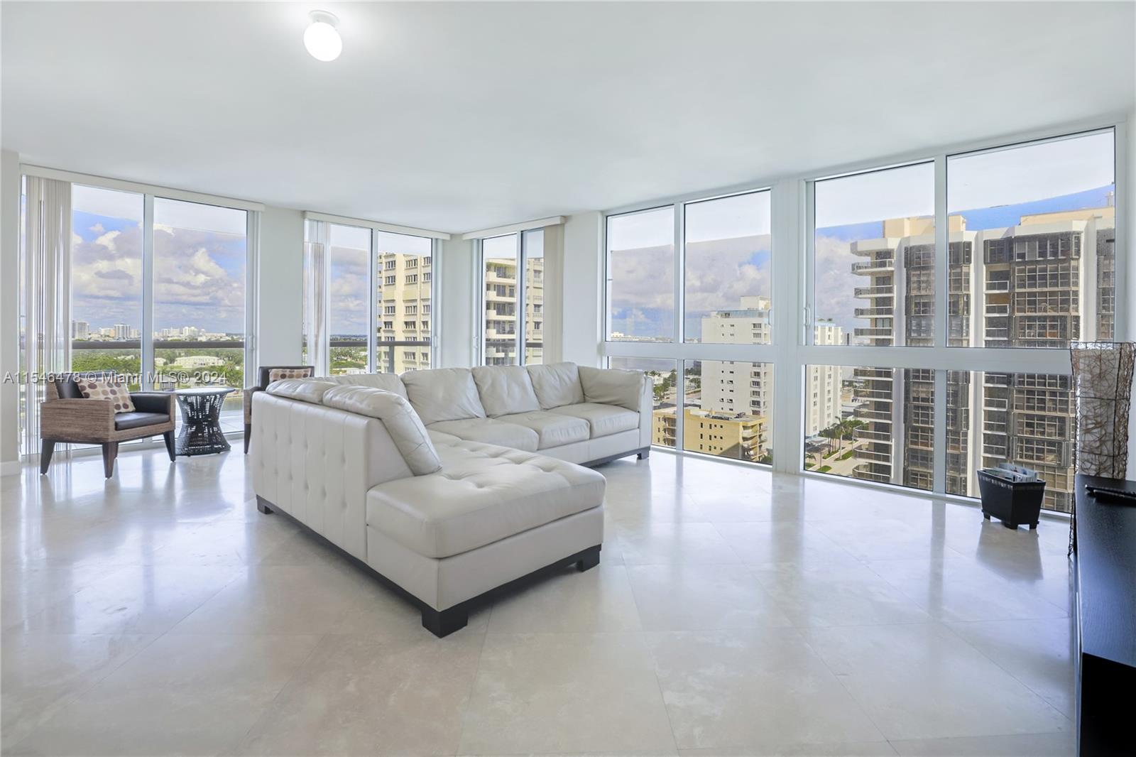 6365 Collins Avenue, Unit 1408 Miami Beach, FL 33141 - Photo 17 of 37 a living room with furniture and a large window