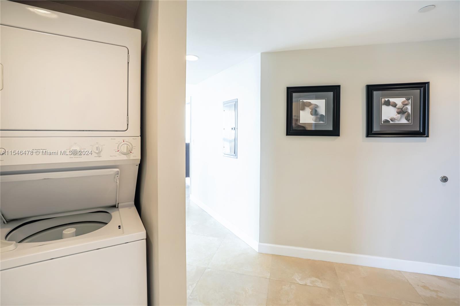 6365 Collins Avenue, Unit 1408 Miami Beach, FL 33141 - Photo 32 of 37 a utility room with dryer and washer