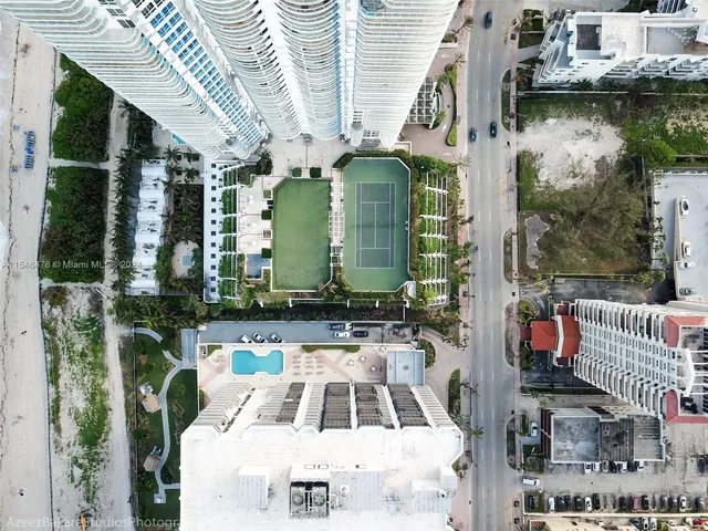 a view of houses with a swimming pool