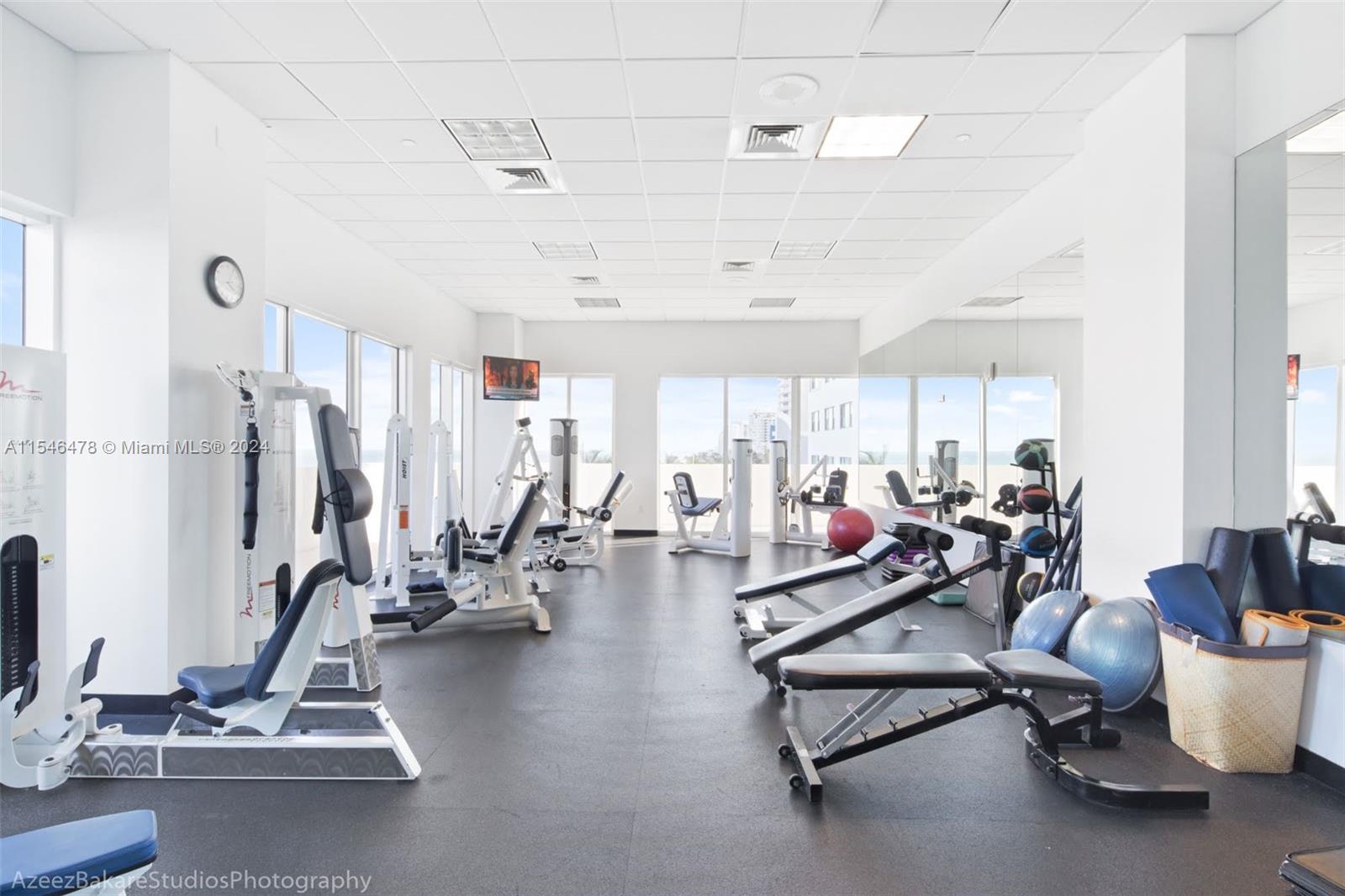 6365 Collins Avenue, Unit 1408 Miami Beach, FL 33141 - Photo 6 of 37 a view of a room with gym equipment