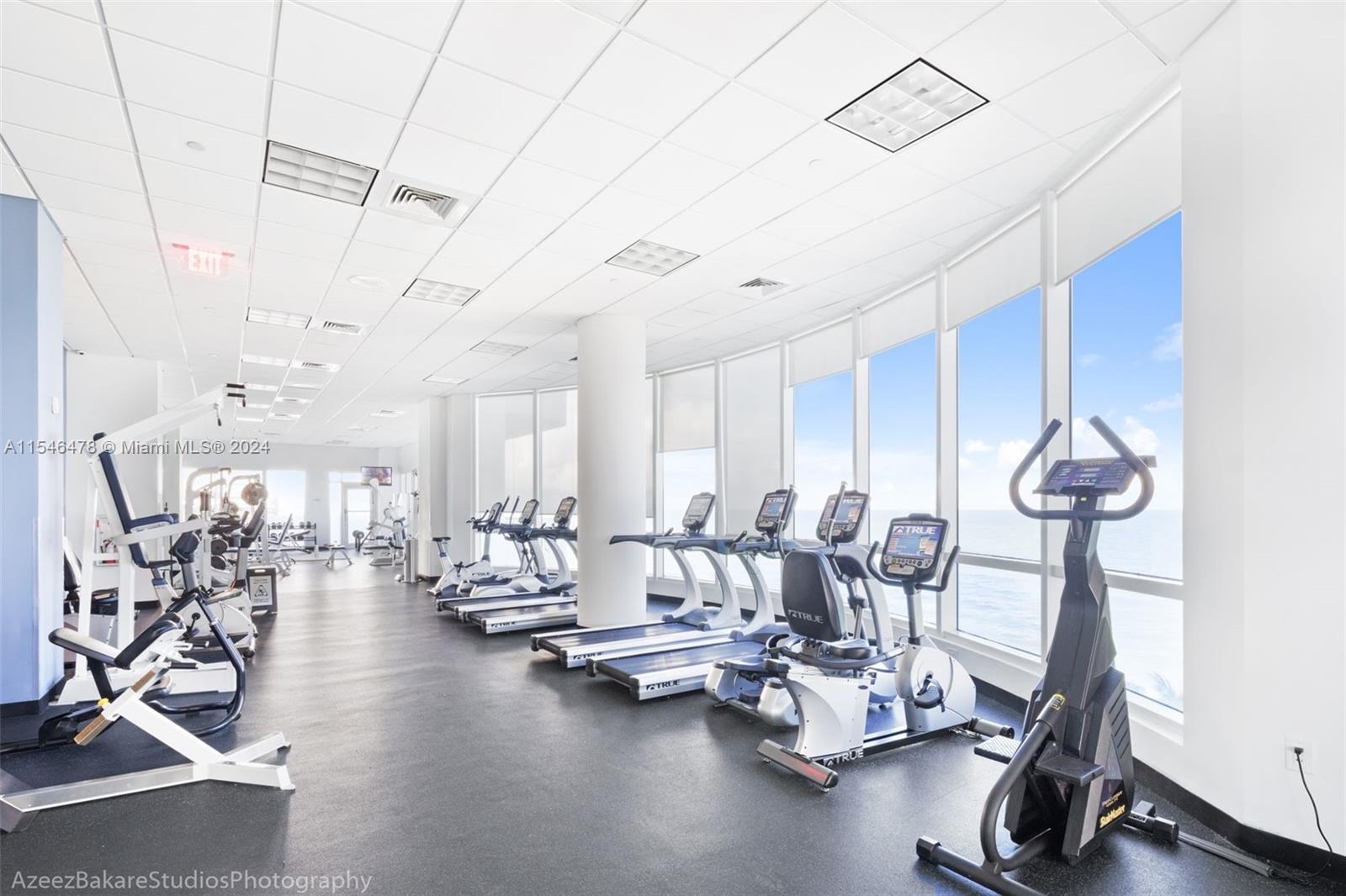 6365 Collins Avenue, Unit 1408 Miami Beach, FL 33141 - Photo 7 of 37 a view of a room with gym equipment