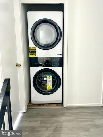 a view of a hallway with washer and dryer