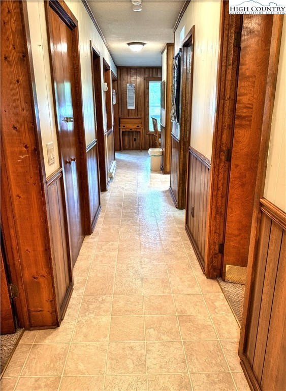 301 Pinnacle Inn Road, Unit 2105 Beech Mountain, NC 28604 - Photo 14 of 23 a view of a hallway with wooden floor and stairs